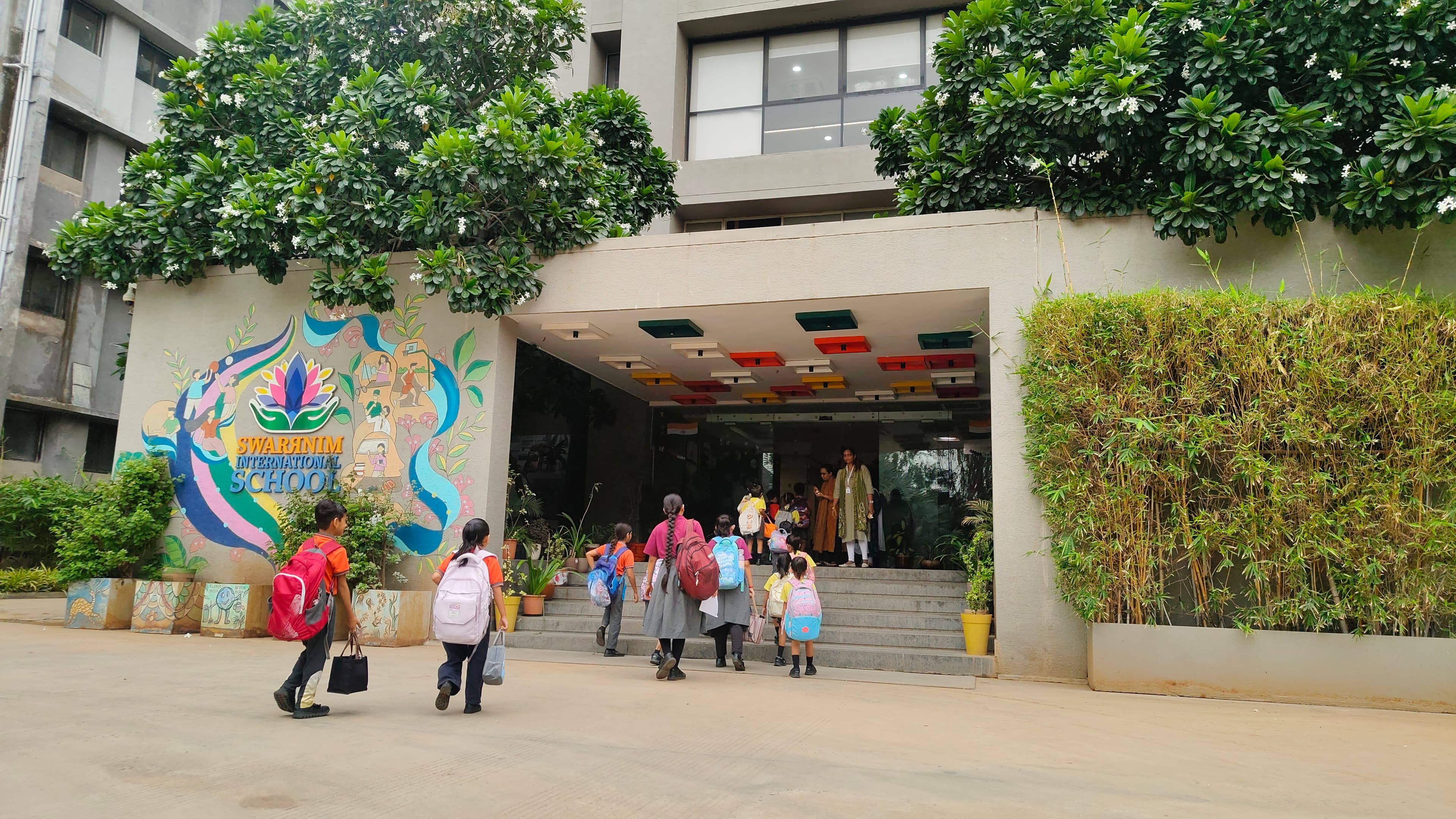 Students arriving at the Swarrnim International School entrance